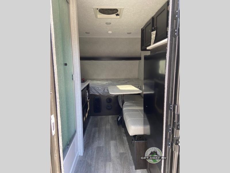 Braxton Creek Bushwhacker Plus 15 RE teardrop trailer interior with seating and  a bed